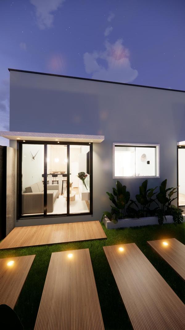 Fachada de uma kitnet com porta de vidro de correr